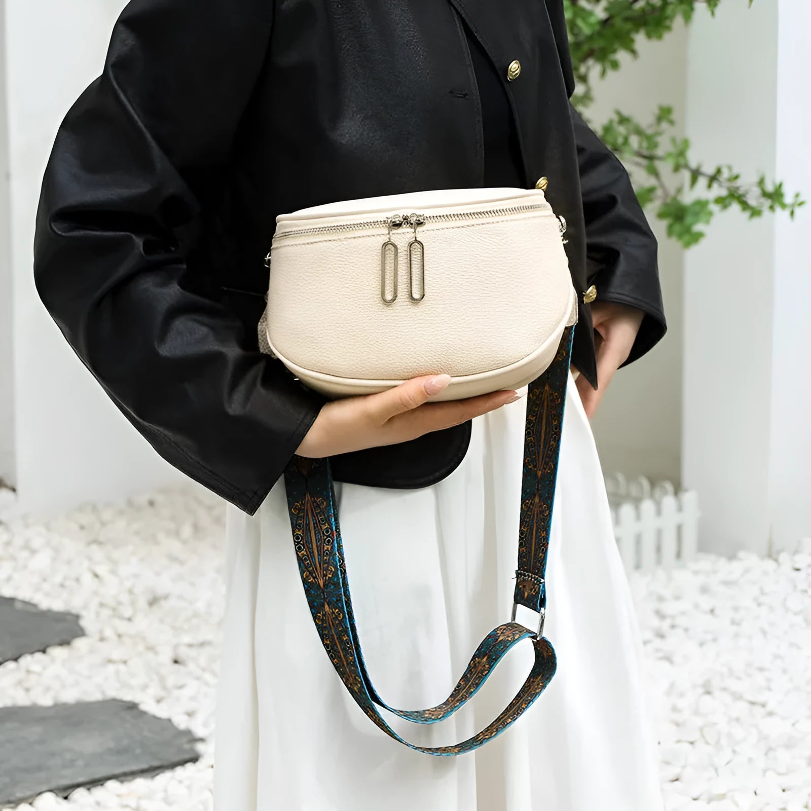 Soft PU leather women's messenger bag in saddle shape with crossbody strap.