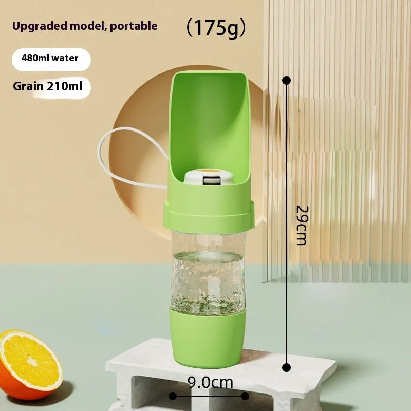 Green portable pet water bottle and food feeder with attached lanyard, showing transparent cup design.