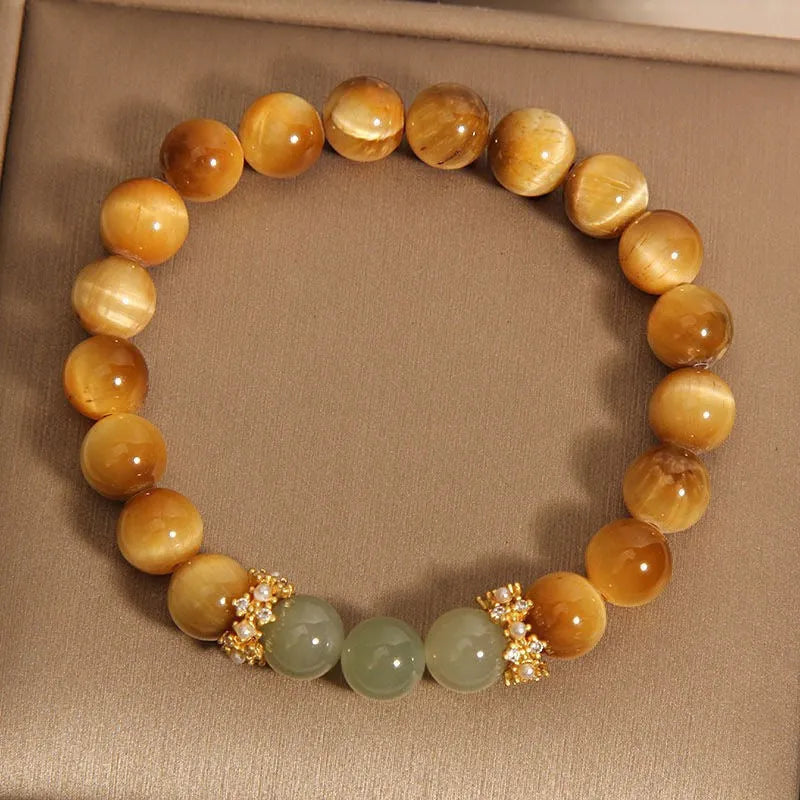 Natural yellow Tiger's Eye stone bracelet in U-shape with auspicious patterns, shown in golden gourd, bamboo joint, and lace styles.