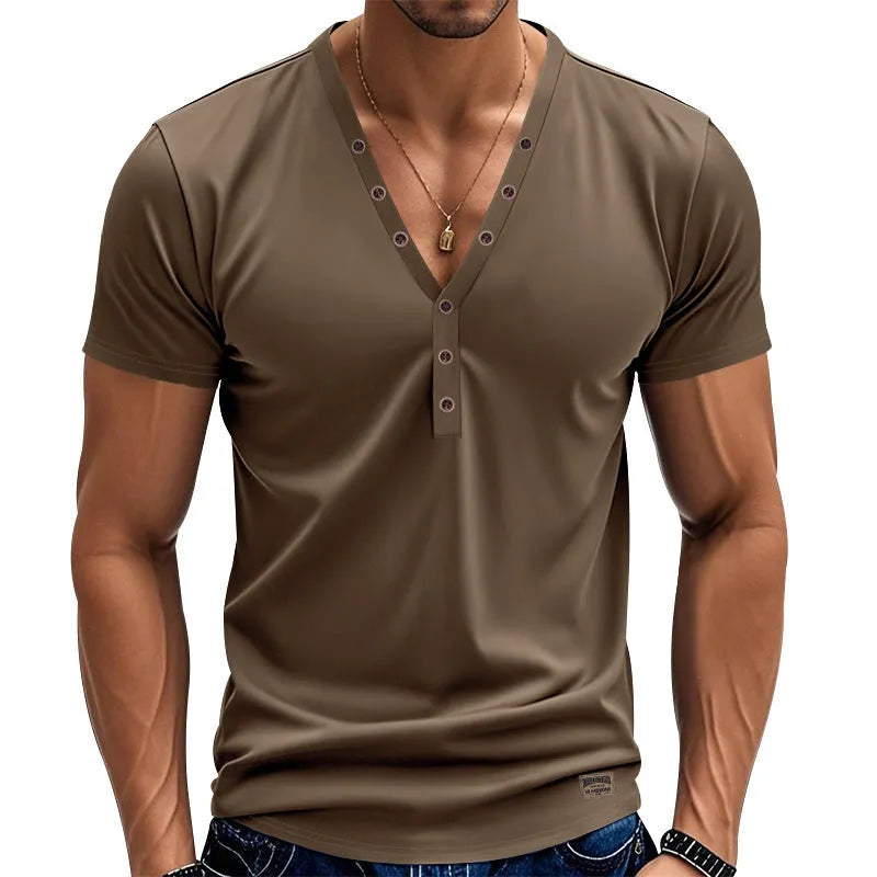 Man wearing a loose-fit grey V-neck button-front casual sports top.