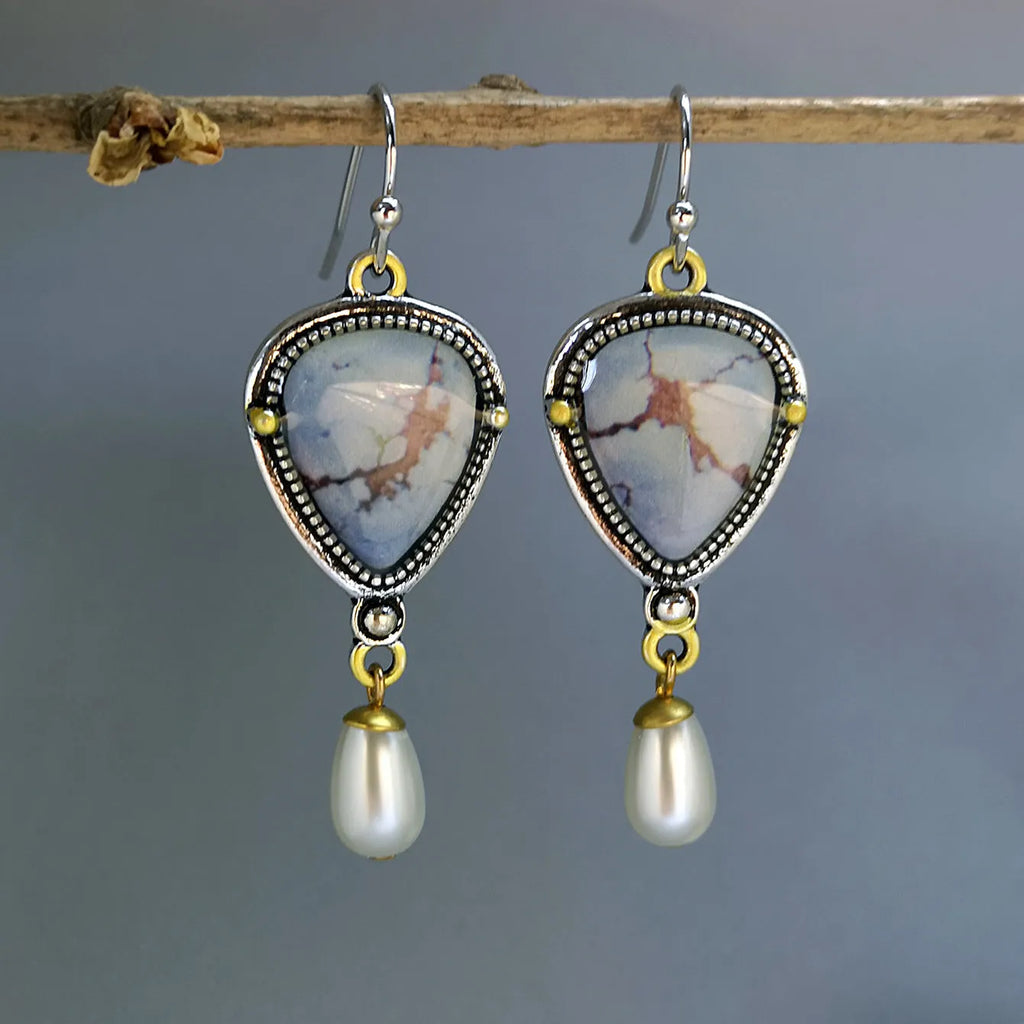 Retro blue geometric drop earrings with synthetic blue opal and white pearl on electroplated metal.