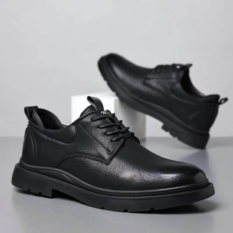 Men's black leather shoes with visible stitching on a two-layer cowhide upper and a rubber sole.