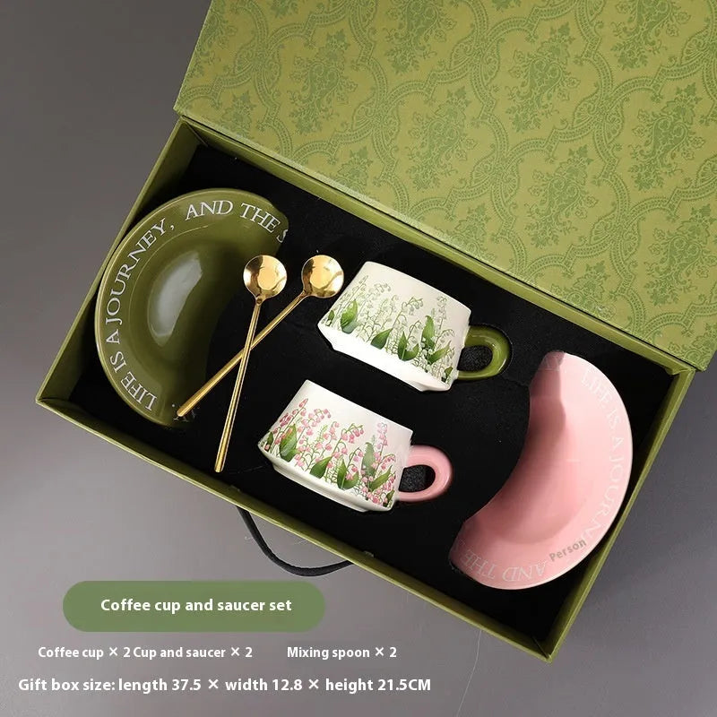 Ceramic coffee cup and saucer set with two cups, plates and stirring spoons
