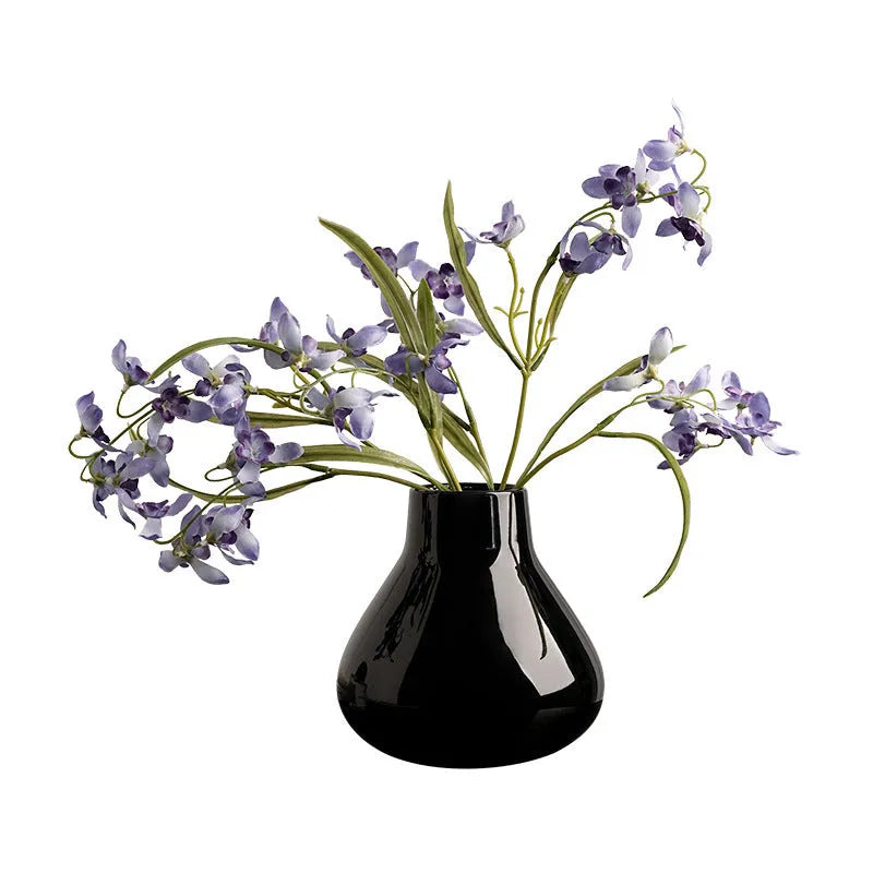 Ceramic round belly decorative vase with coloured glaze and artificial flowers in black or white