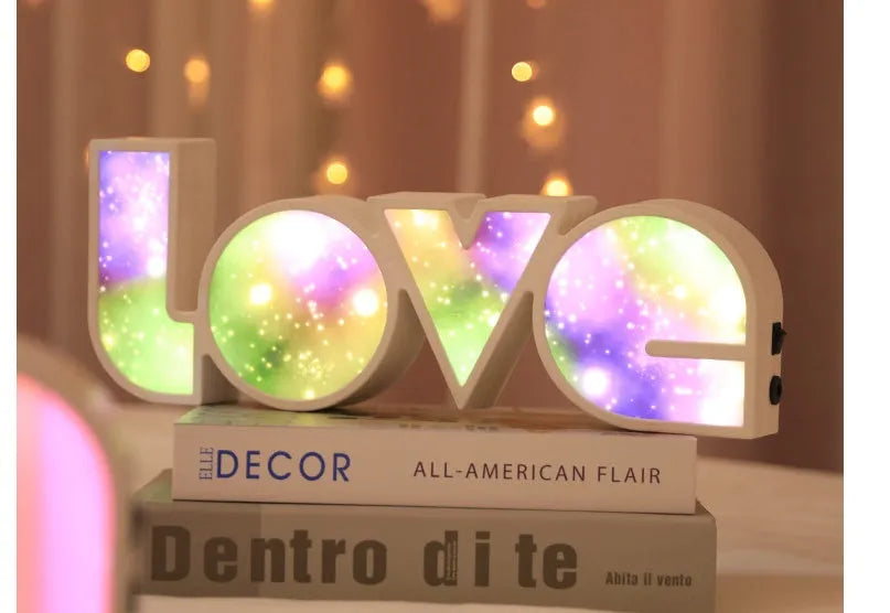 Colourful rainbow LED decorative light spelling LOVE, with USB cable, for Valentine's Day or wedding decor.
