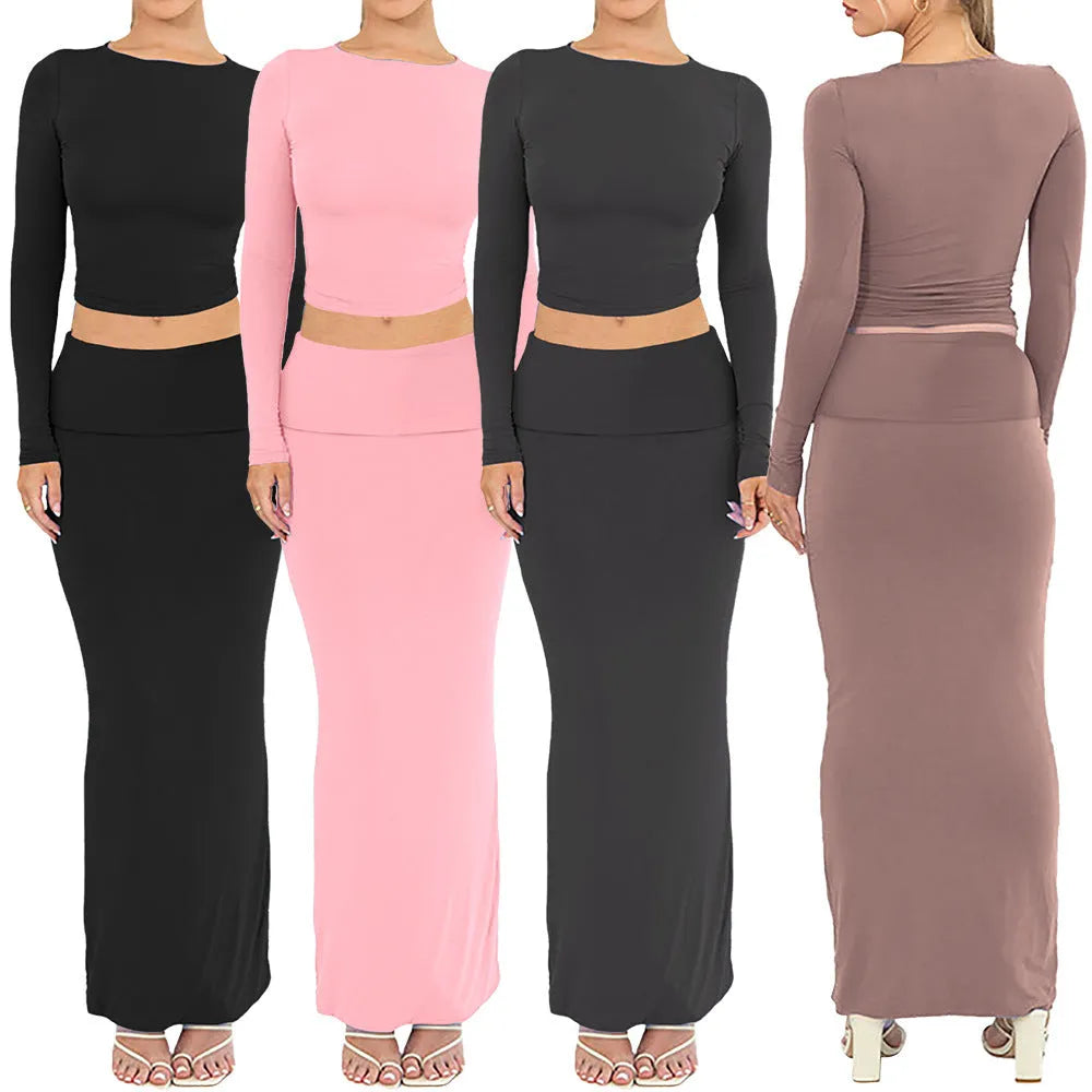 Women's slim fit polyester two-piece suit set with three-quarter sleeves and long skirt in black.