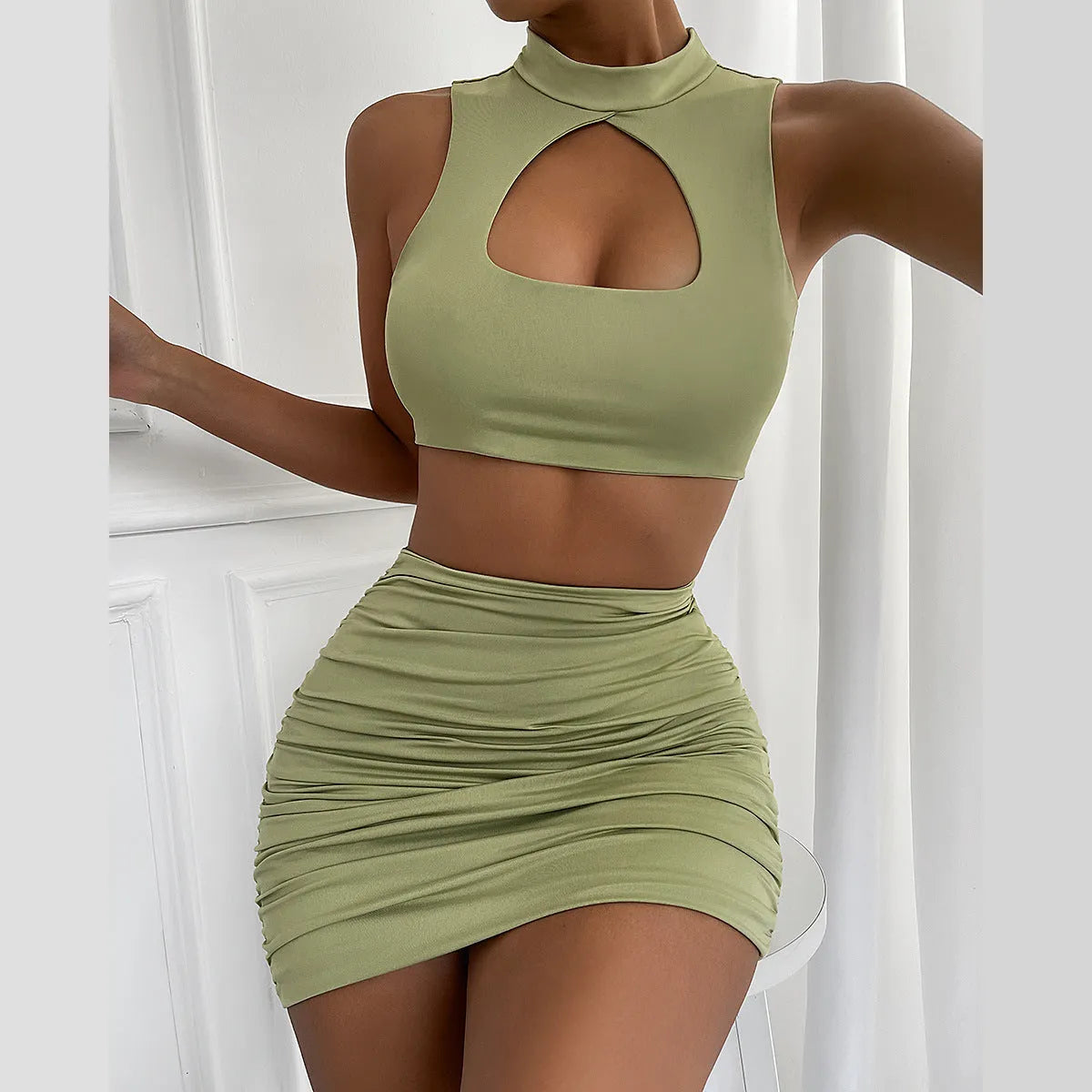 Women's light purple elastic polyester two-piece set with hollow vest top and split skirt