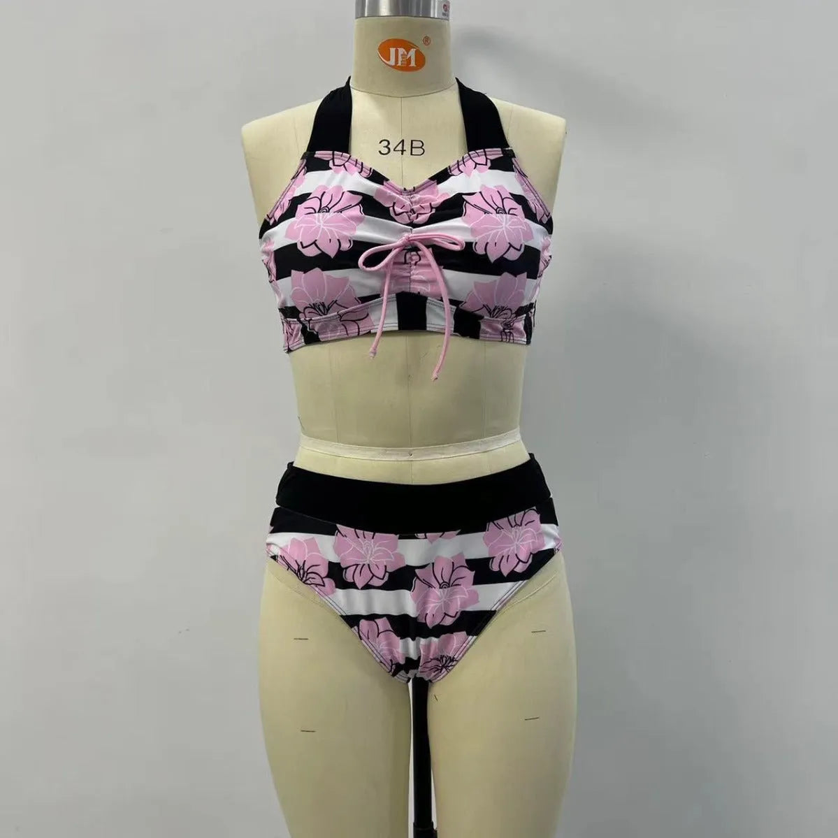 Black women's printed bikini set with belly-covered slimming design for swimming.
