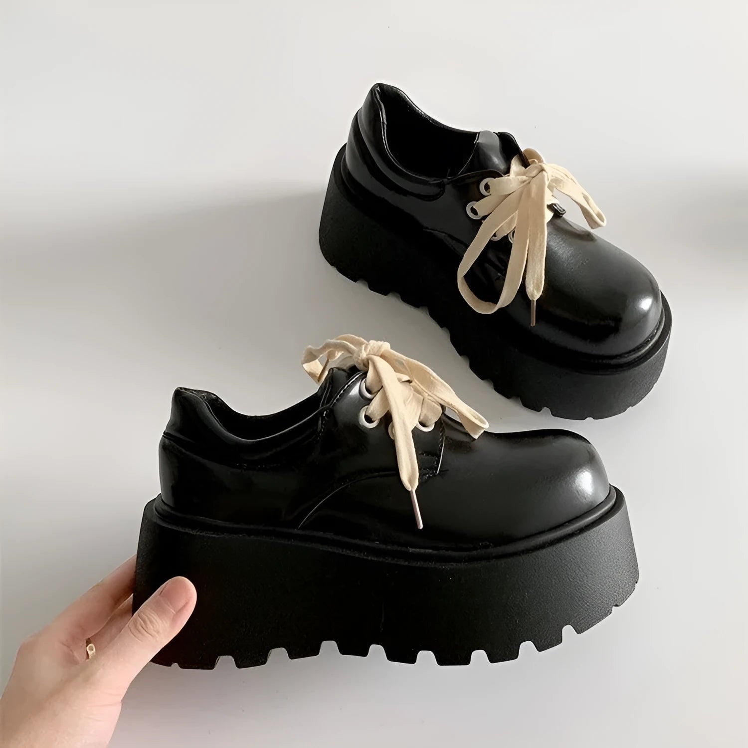 Women's matte black lace-up shoes with thick rubber sole and chunky 6-8cm heel, round toe.