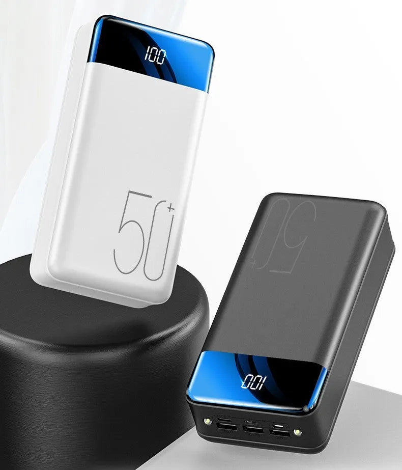 Black or white 50000mAh power bank with three USB output ports showing size scale