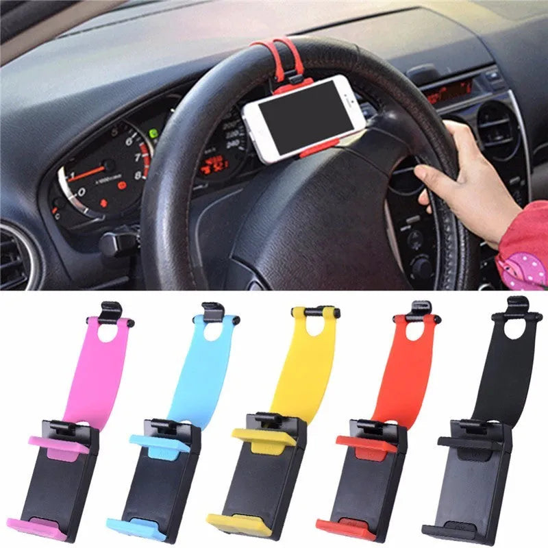 Black universal steering wheel phone holder clip mounted on a car steering wheel.