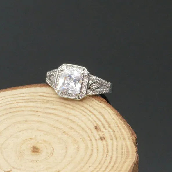 Women's platinum-colour hollow geometric zircon ring on a copper band, shown in size 7.