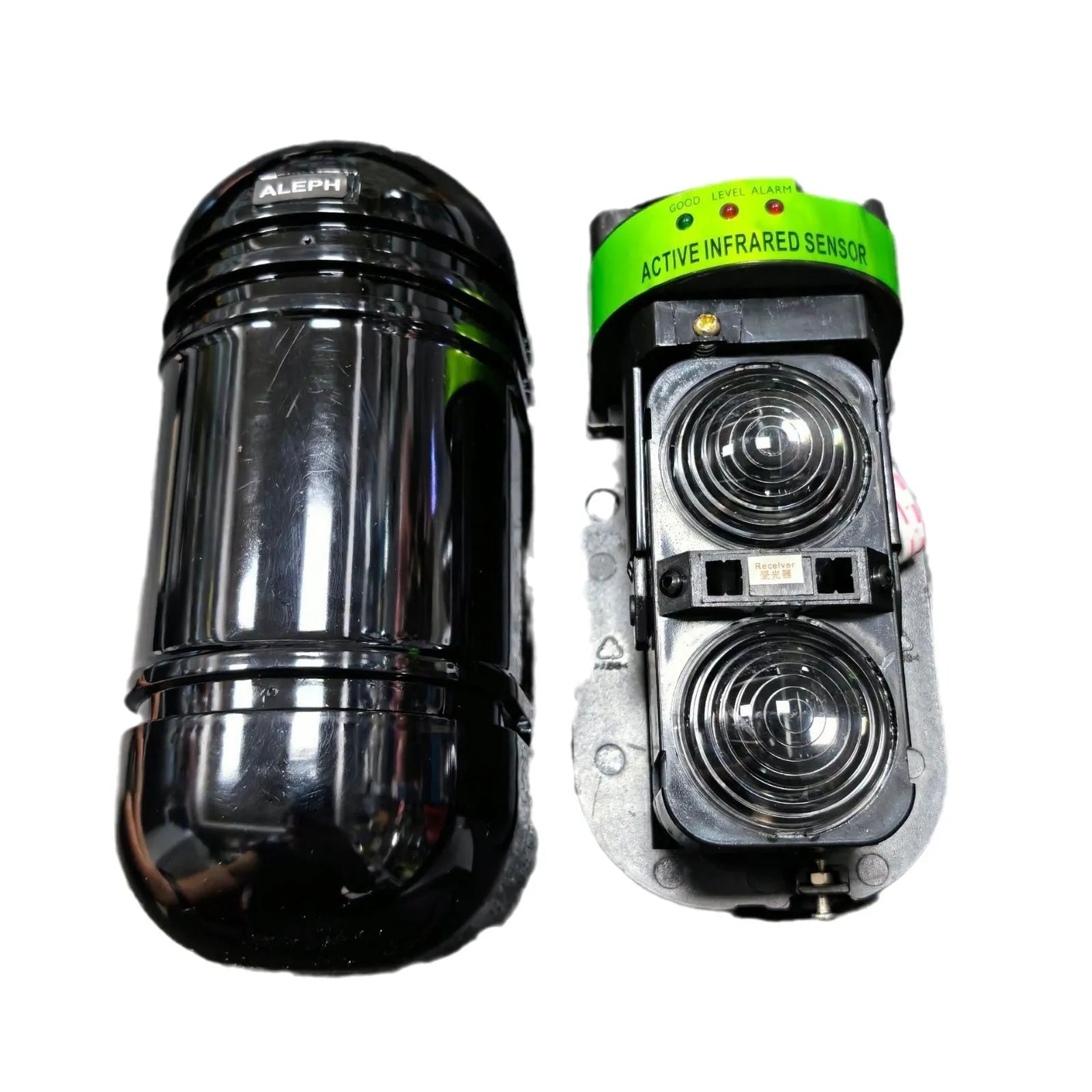 A pair of black infrared beam detectors for long-range perimeter security alarm systems.