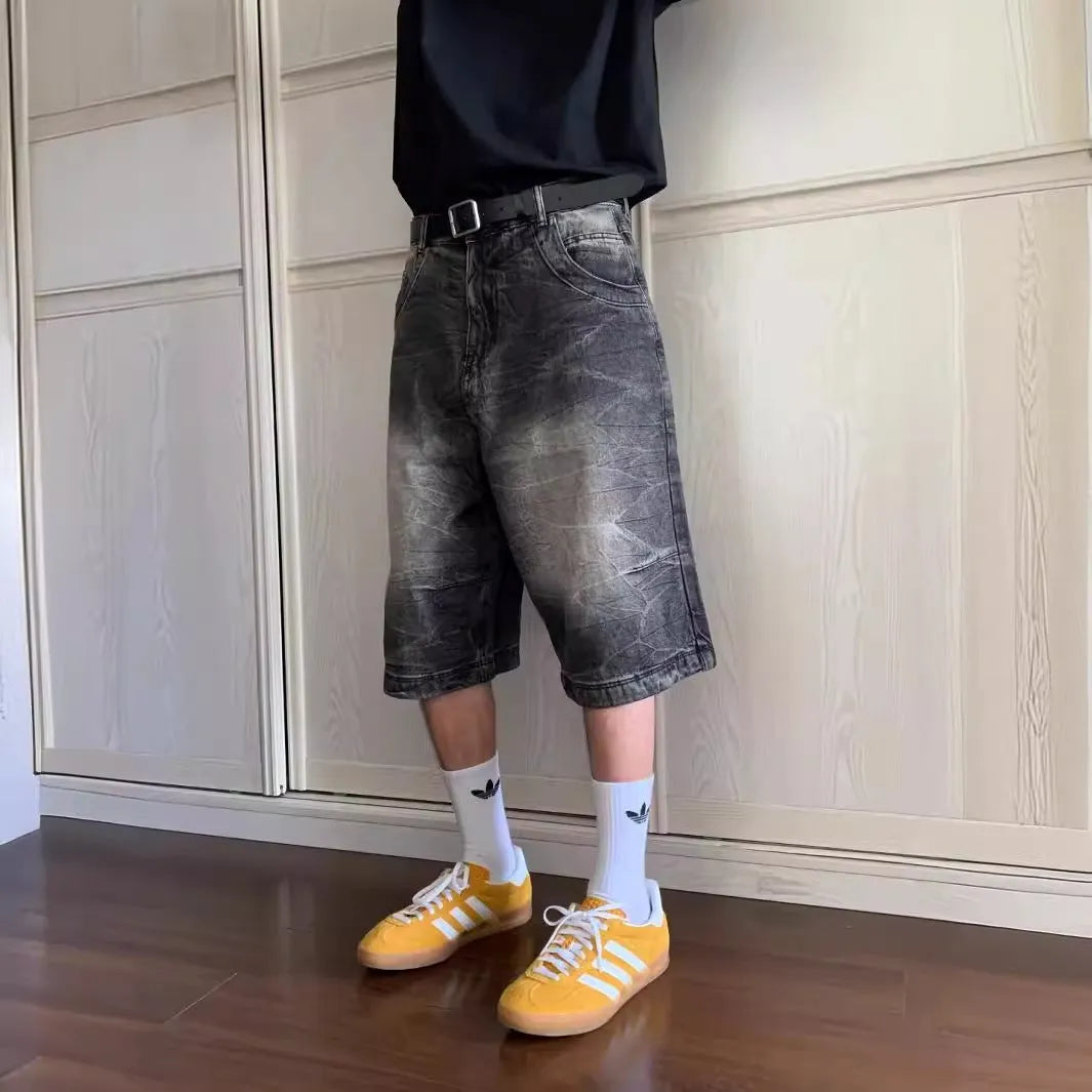 Men’s loose straight-leg washed denim shorts in blue side view