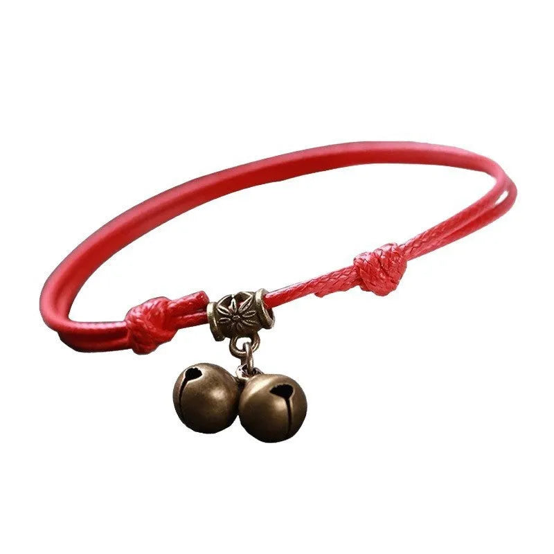 Adjustable nylon dog collar with brass bell in black, red, and coffee colours.