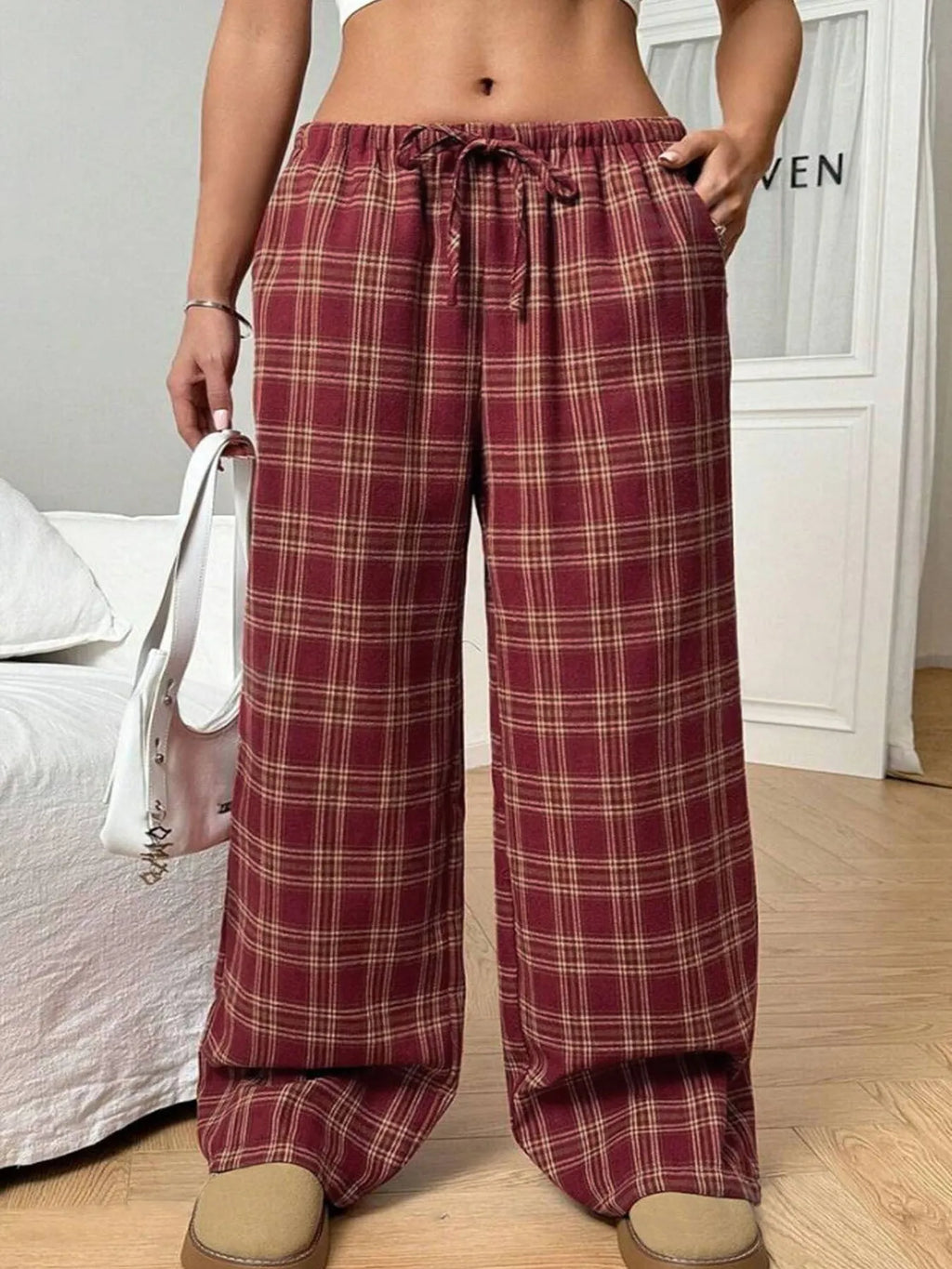 Women's loose fit plaid trousers with drawstring waist and side pockets in red colour