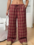 Women's loose fit plaid trousers with drawstring waist and side pockets in red colour