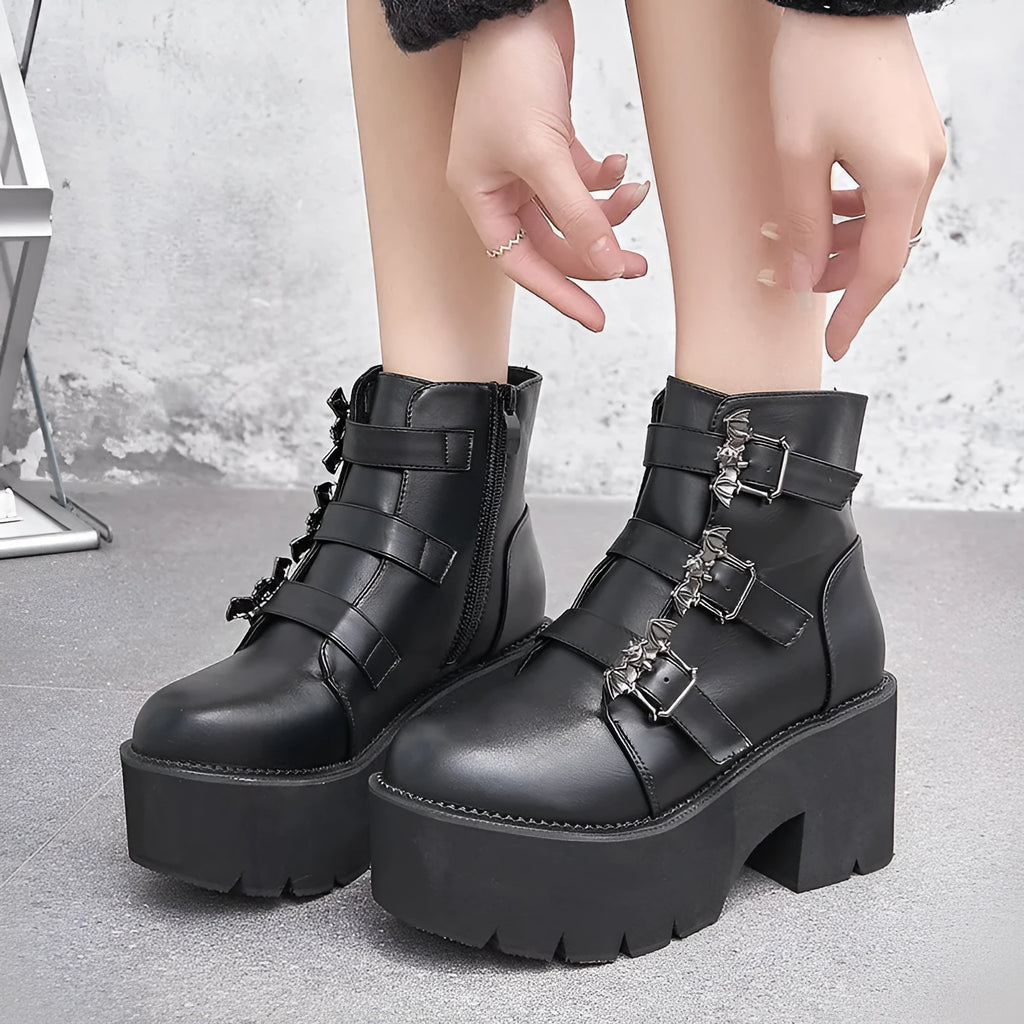Black women's Harajuku punk ankle boots with bat buckle, thick heel, and side zip.
