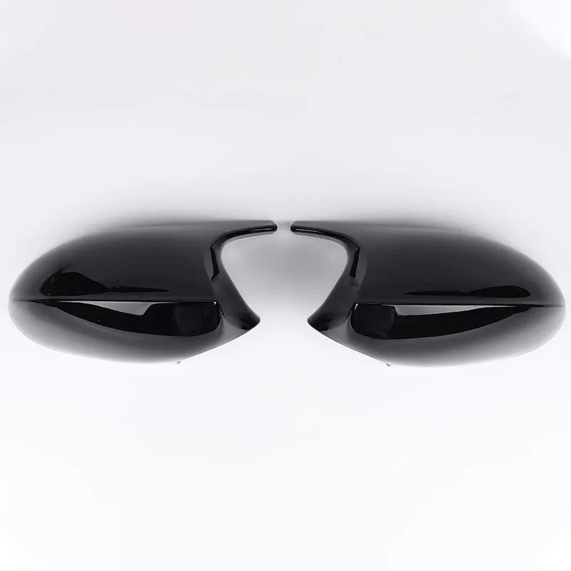 Pair of BMW 3 Series E90 ABS plastic rearview mirror housings in black and carbon pattern finishes