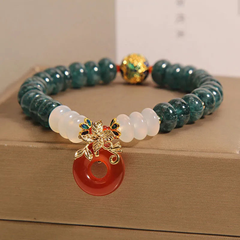 Blue water jade and red agate bracelet with crystal beads and a peace buckle closure