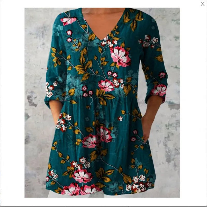 Women's printed loose wave dress with 3/4 sleeves and a wide waist on a hanger.