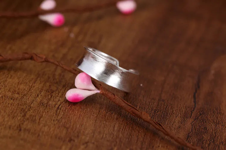 Geometric open ring in frosted sterling silver with adjustable opening