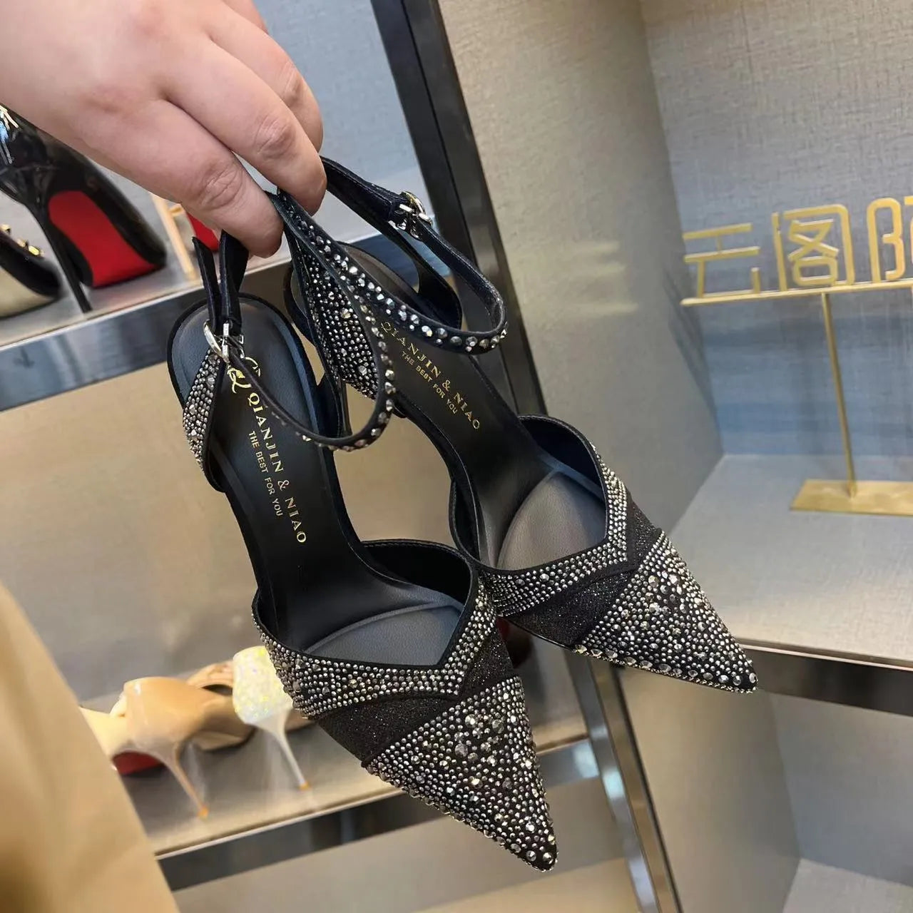 Women's hollow stiletto high heels with red sole and pointed toe design in black and silver options