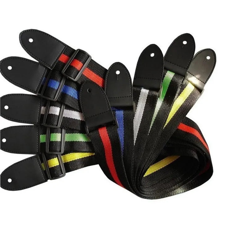 A woven crossbody guitar strap with a stripe pattern, shown attached to an electric guitar.