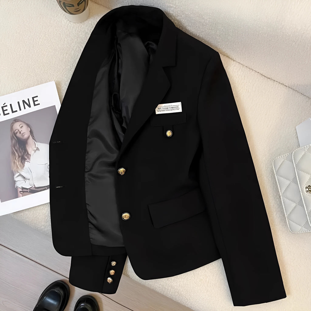 Black women's loose-fit suit coat with long sleeves and pockets for college and commute wear.