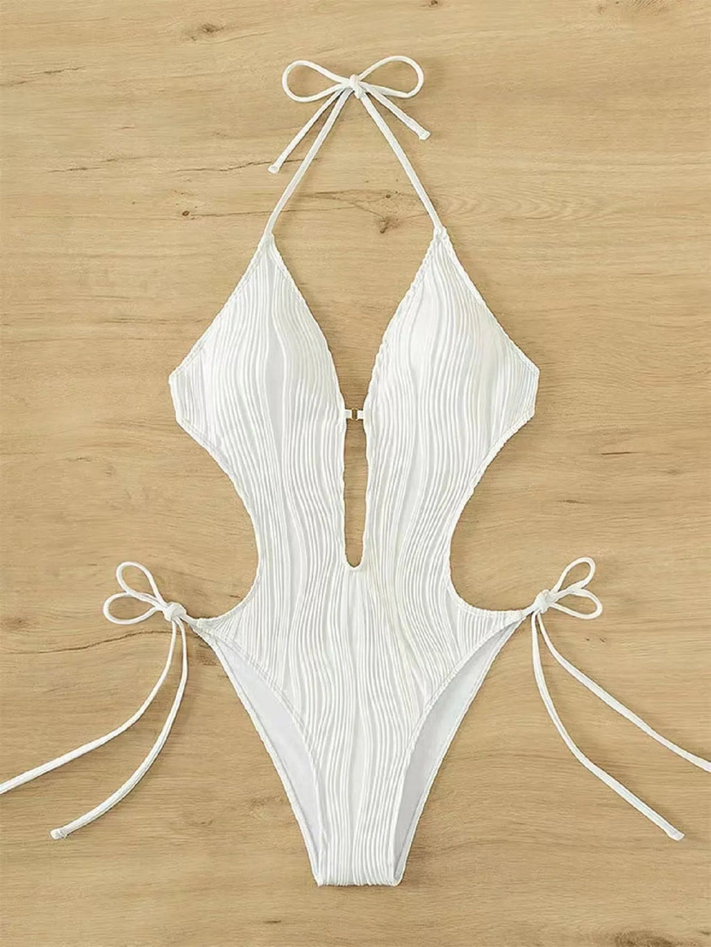 Black and white lace-up triangle bikini swimsuit for women on a size chart background