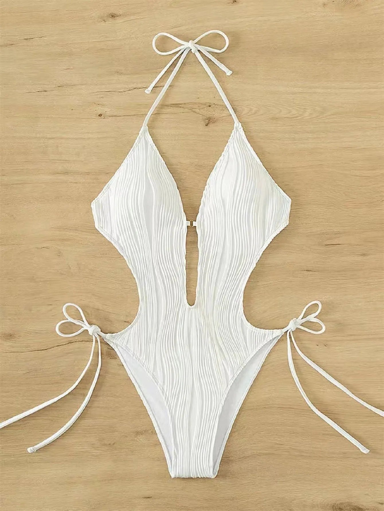 Black and white lace-up triangle bikini swimsuit for women on a size chart background