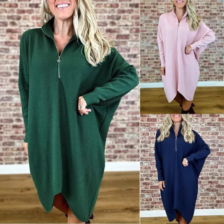 Women's solid colour knitted loose dress with zip and raglan sleeves, shown in dark green.