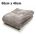 Three size options of a blue microfiber car wash and drying towel laid flat.