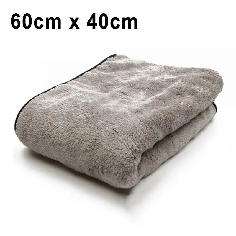 Three size options of a blue microfiber car wash and drying towel laid flat.