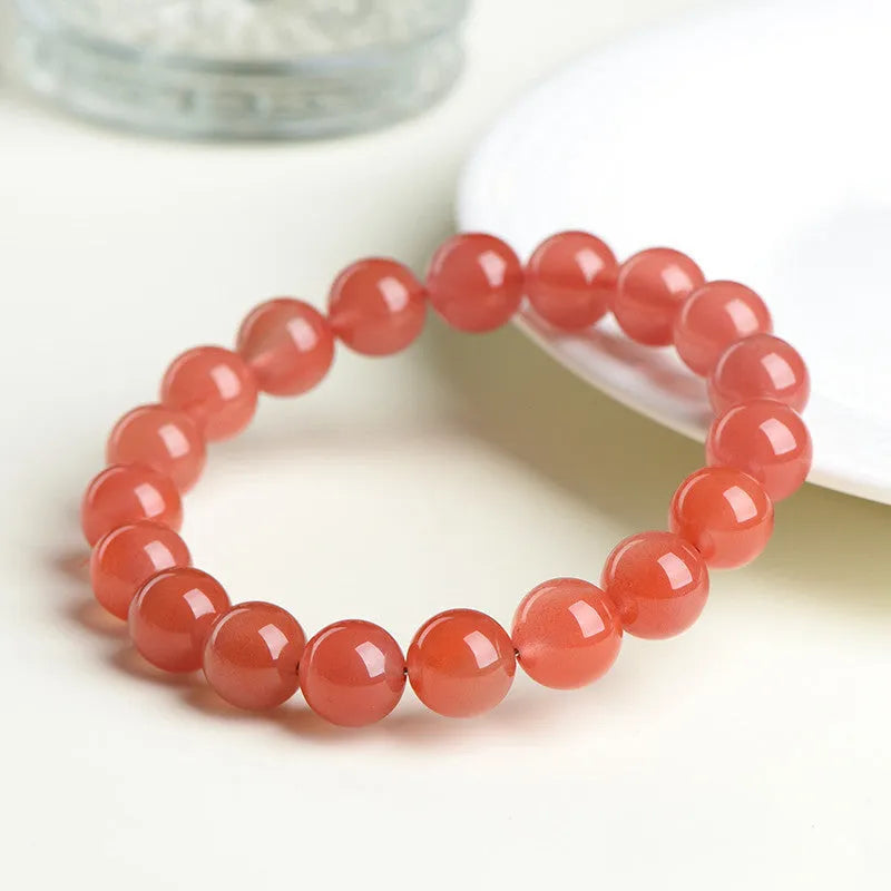 Natural Cherry Red Agate bracelet with polished beads, shown in a single circle configuration.