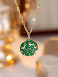 Round pendant necklace with emerald diamond elements on champagne gold electroplated chain