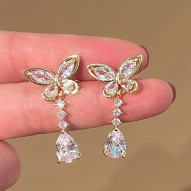 Bow-shaped stud earrings with electroplated platinum finish on zinc alloy
