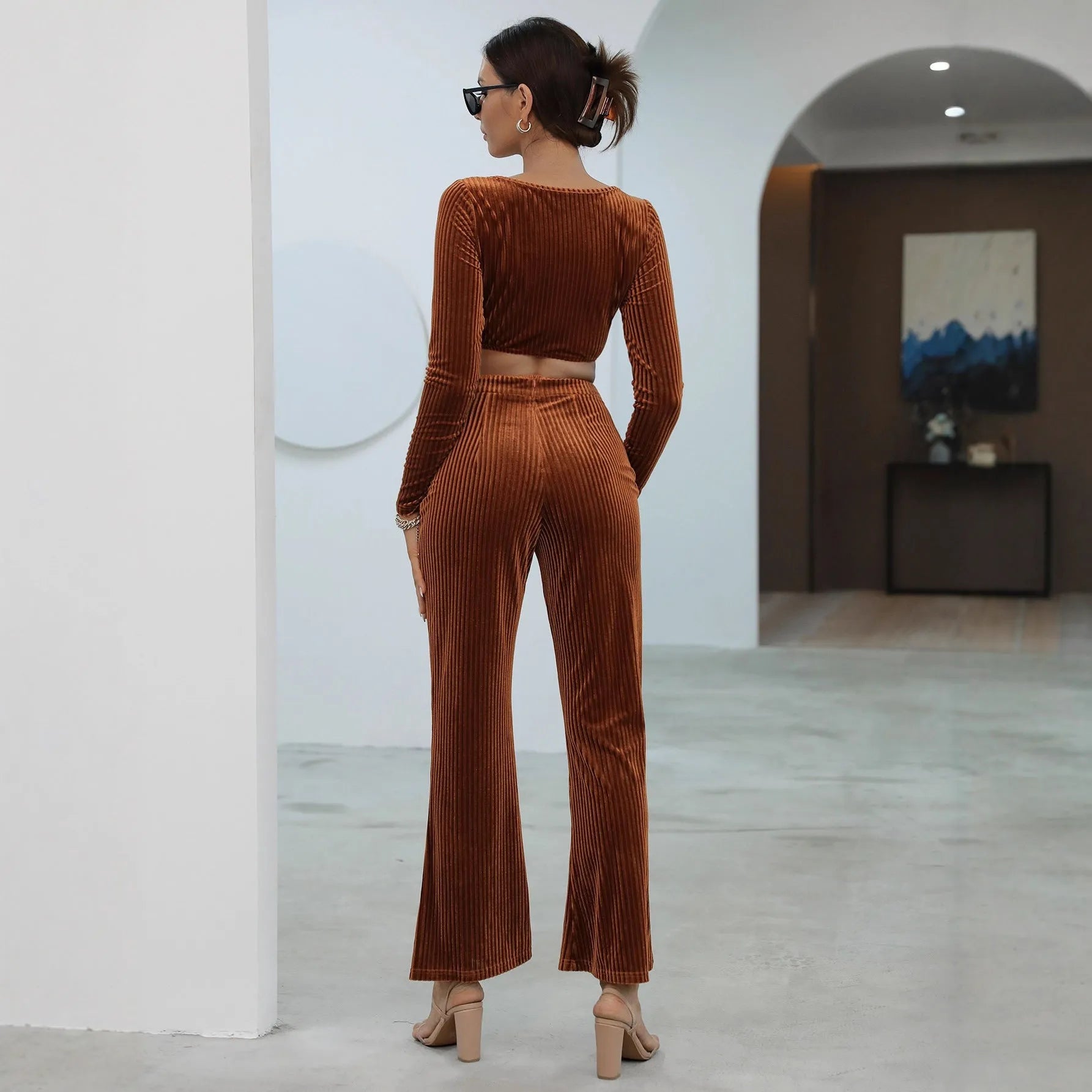 Caramel coloured long sleeve sweater and matching trousers casual set on hanger