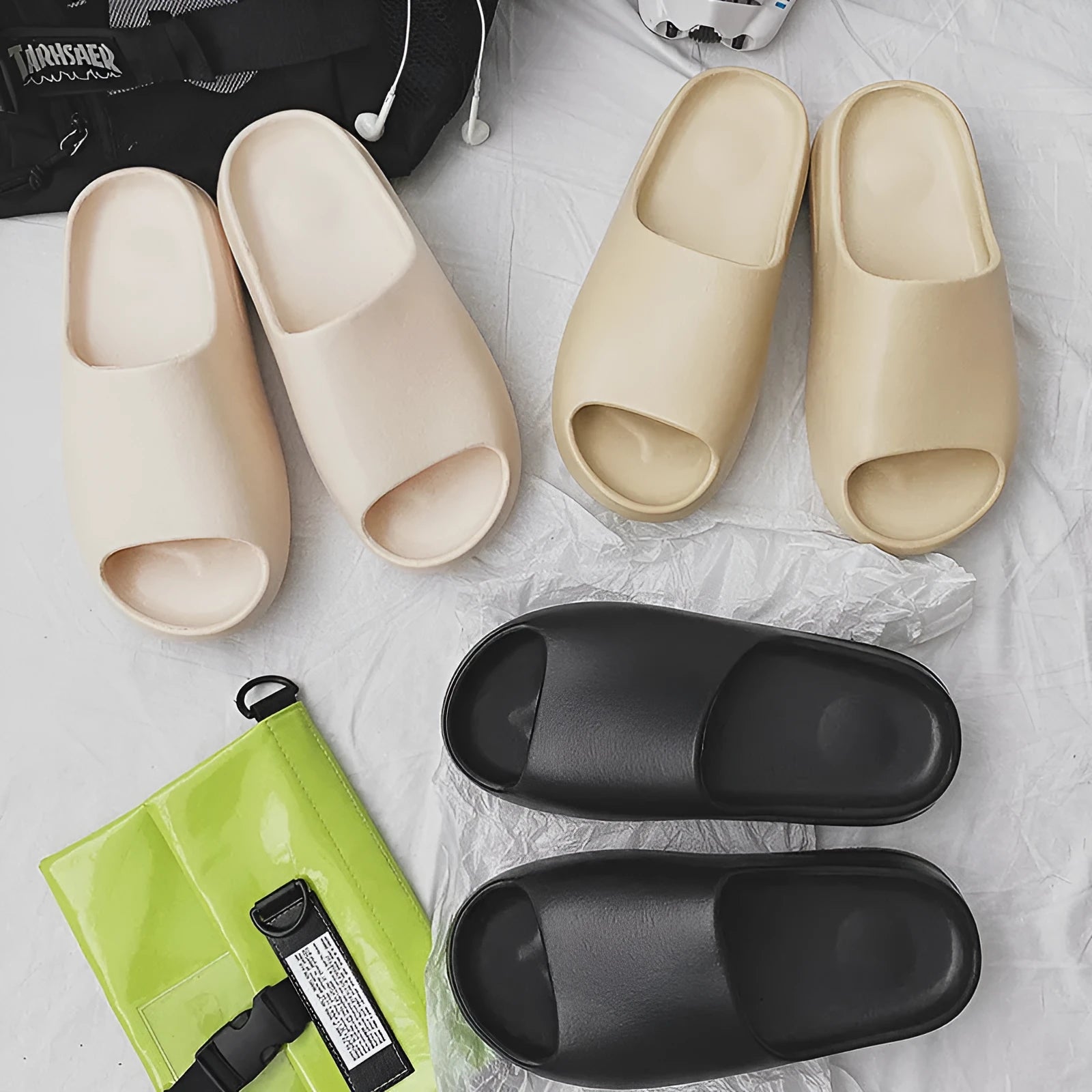 Women's thick sole beach slippers in black, green, brown, and beige colours on an EVA sole.