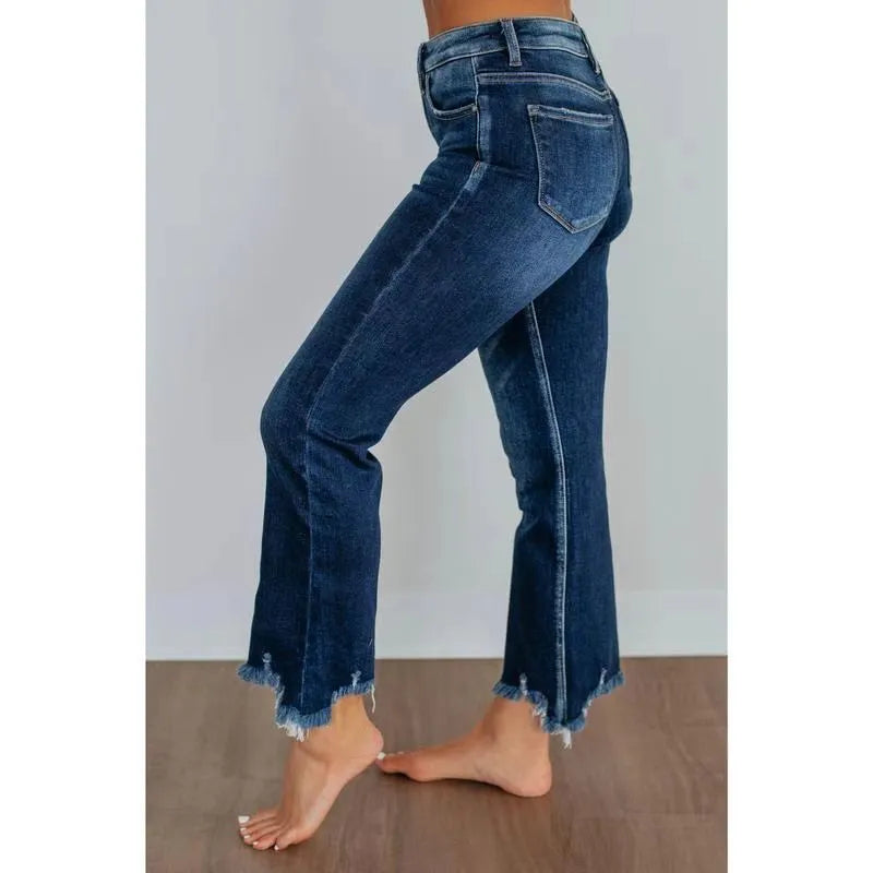 Women's solid colour denim jeans with a hand-worn finish, shown in dark blue and light blue.