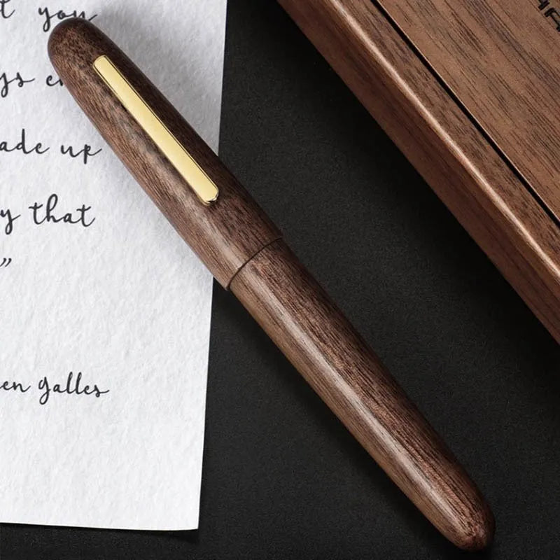 Wooden fountain pen with rotating cap shown in selected wood finish with chosen nib type.