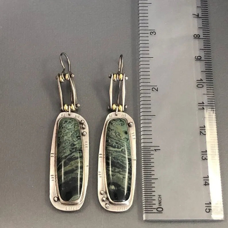 Two-colour marble pattern geometric alloy earrings showing geometric shape and two-tone surface design