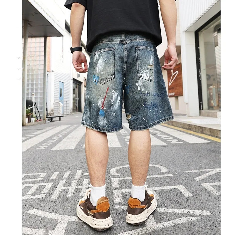 Blue ripped men's denim jeans shorts with graffiti patterns and straight-leg style