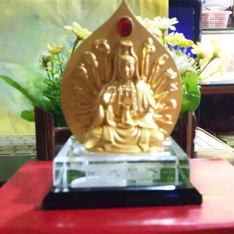Traditional Chinese alloy prayer wheel car decoration on a dashboard