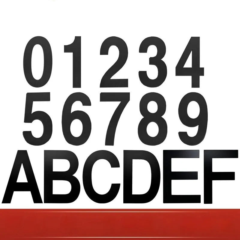 Black stainless steel adhesive house number sign showing digit 7, 7.5cm tall on adhesive backing.