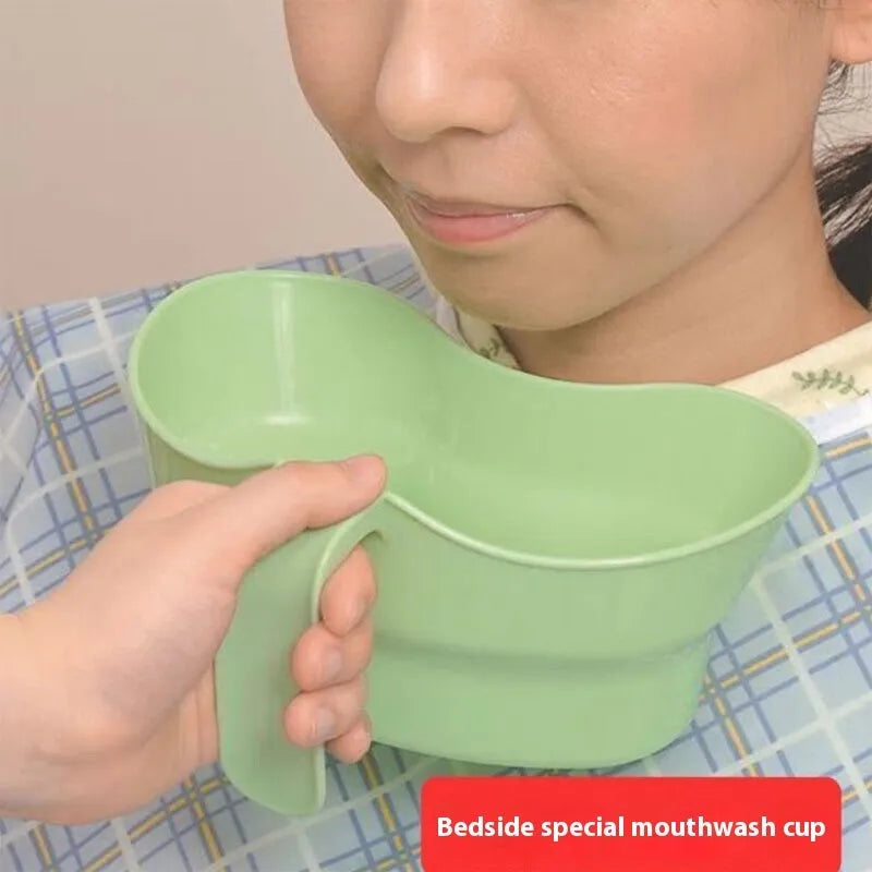 Green plastic nursing gargle cup with white lid for bedside oral care