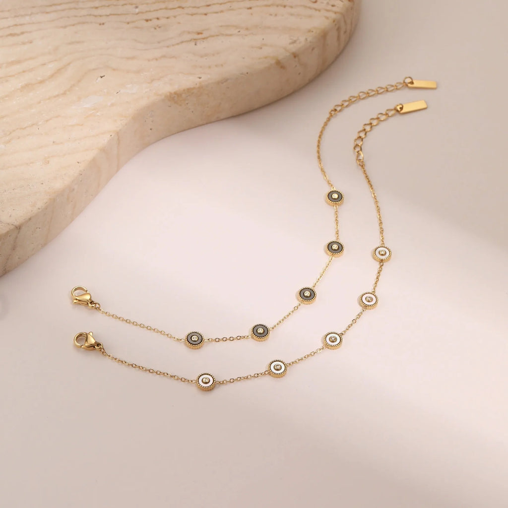 Stainless steel women's bracelet with 18K gold plating and geometric fritillary design