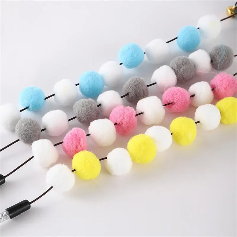 31cm long cat teaser rod with pompon feather and bell attachments in multiple colour options