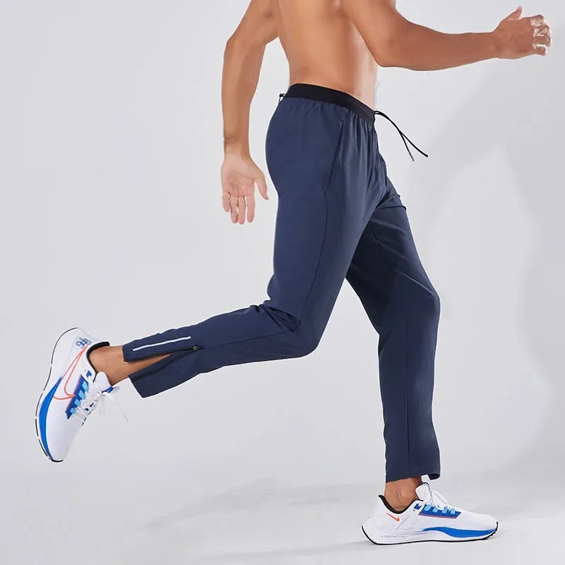 Men's loose quick-drying polyester sports trousers in navy blue, mid-waist with an American style cut for running and fitness