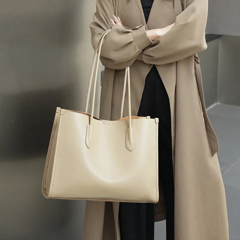 Women's genuine leather commuter tote bag in golden brown with double straps and stitching detail